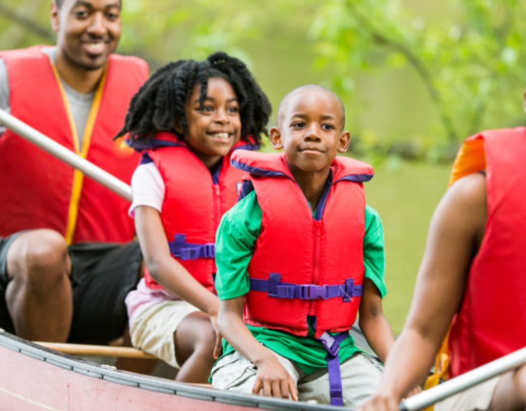 African American family canoeing.